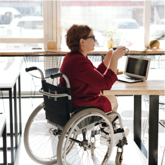 woman in wheelchair on laptop